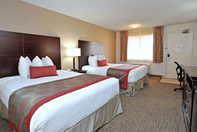 Twp queen size beds in hotel room